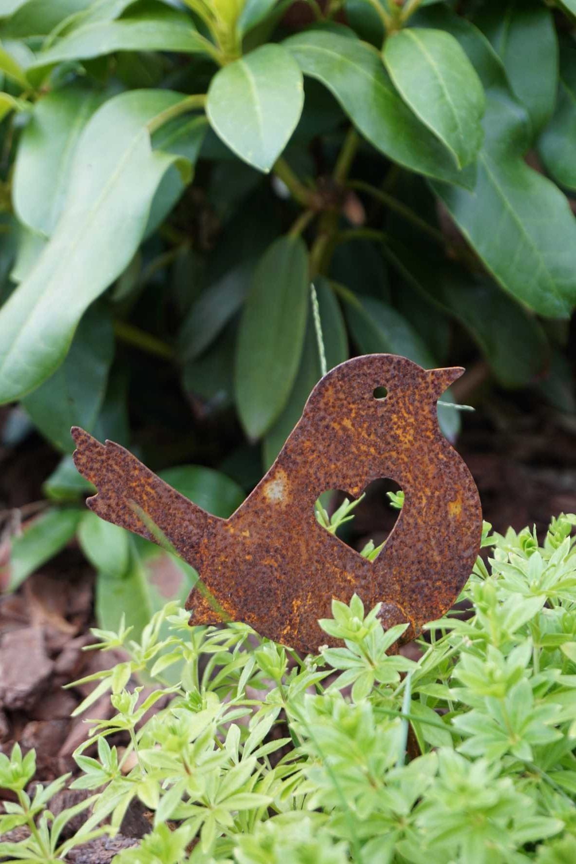 Little bird with heart on stick