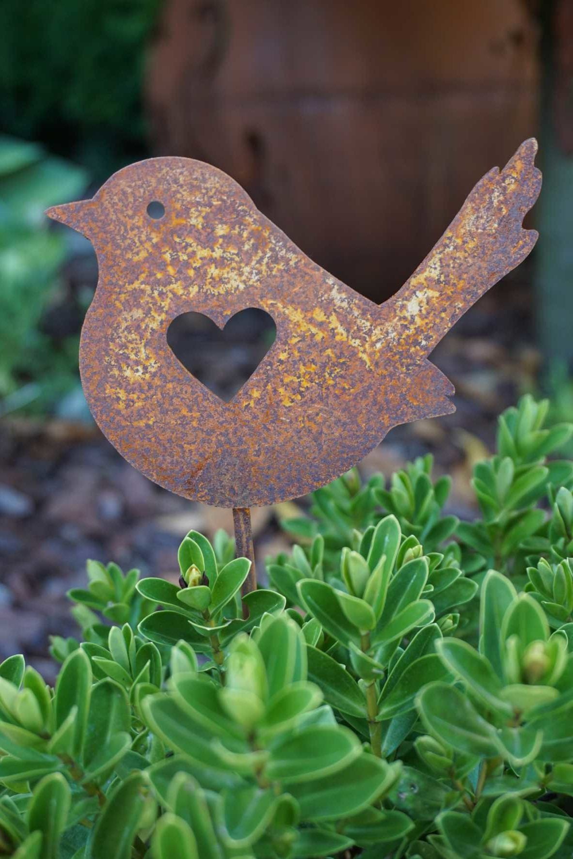 Bird with heart on a stick