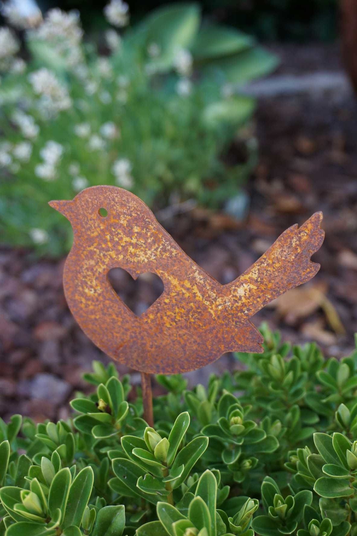 Bird with heart on a stick