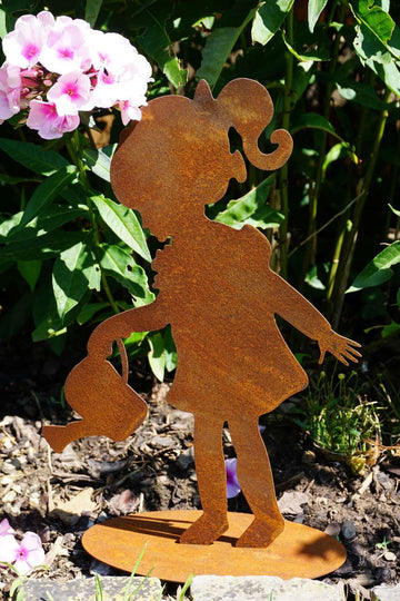 Girl watering flowers made of rusted metal