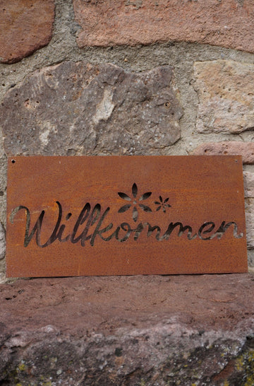 Sign "Welcome" with flower