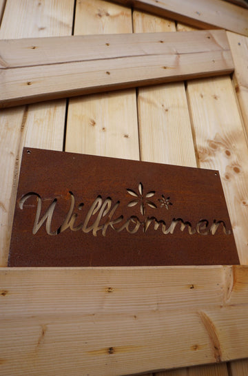 Sign "Welcome" with flower