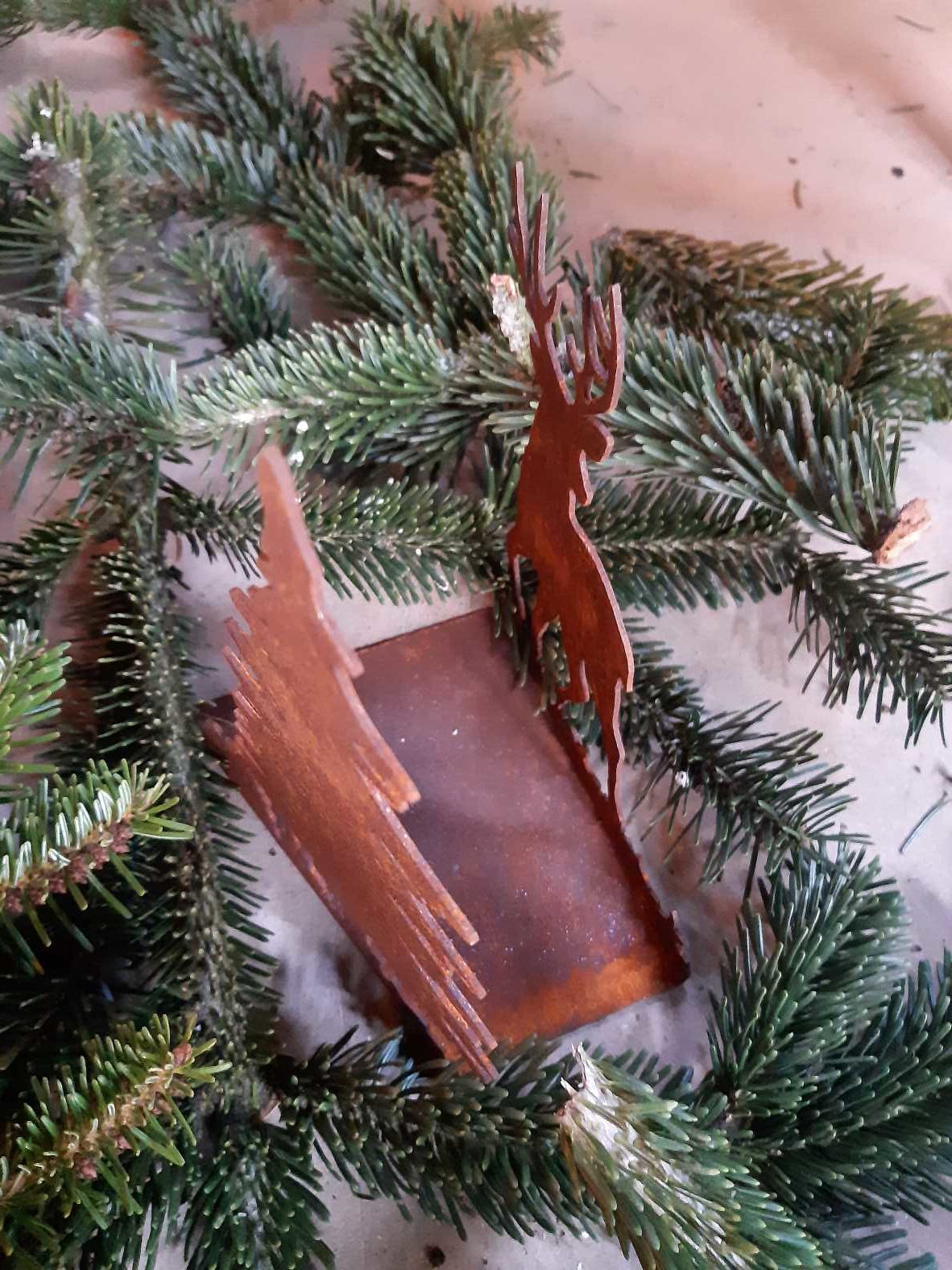 Tealight holder with deer and fir tree
