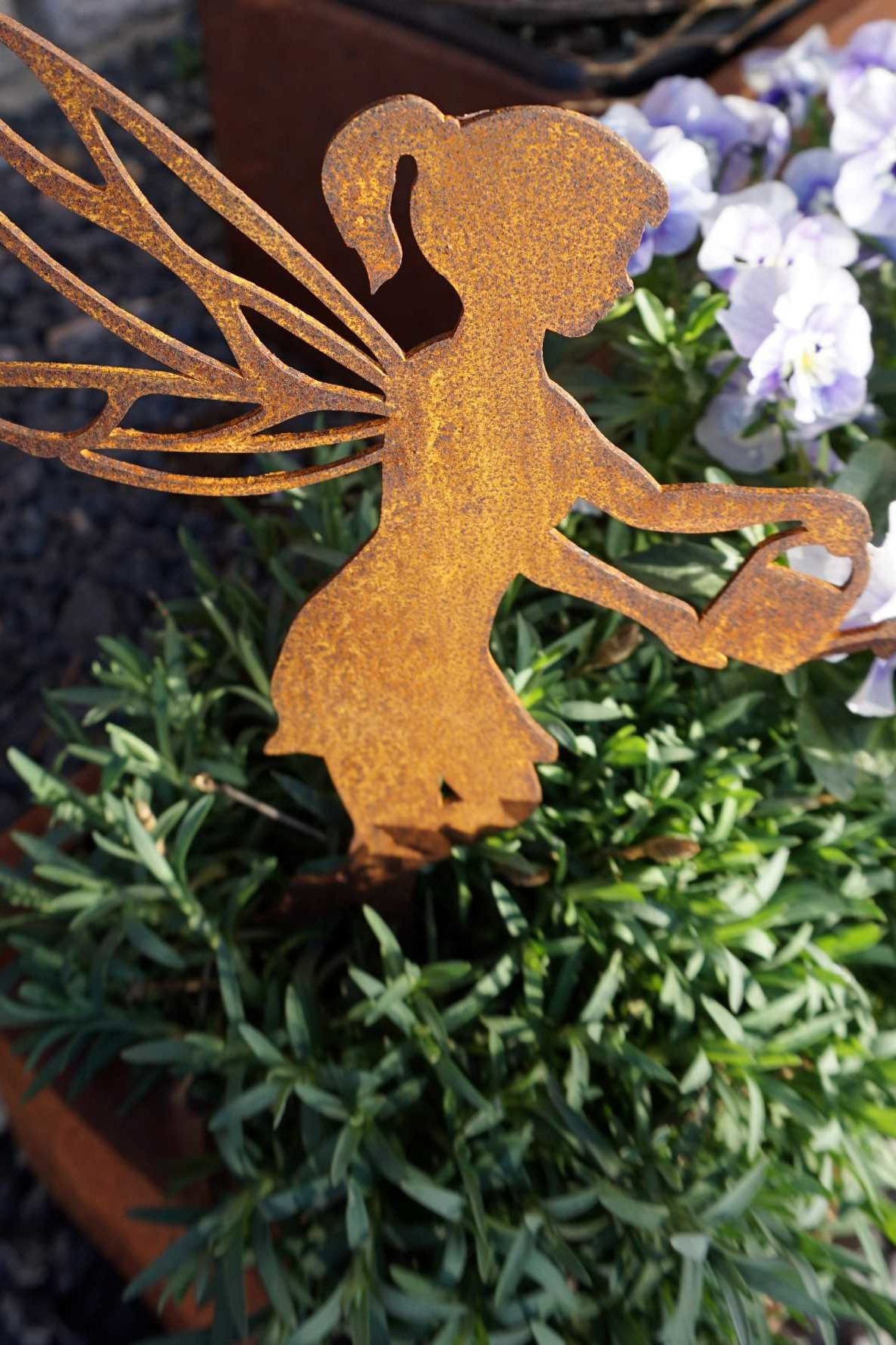 Gardening fairy with watering can