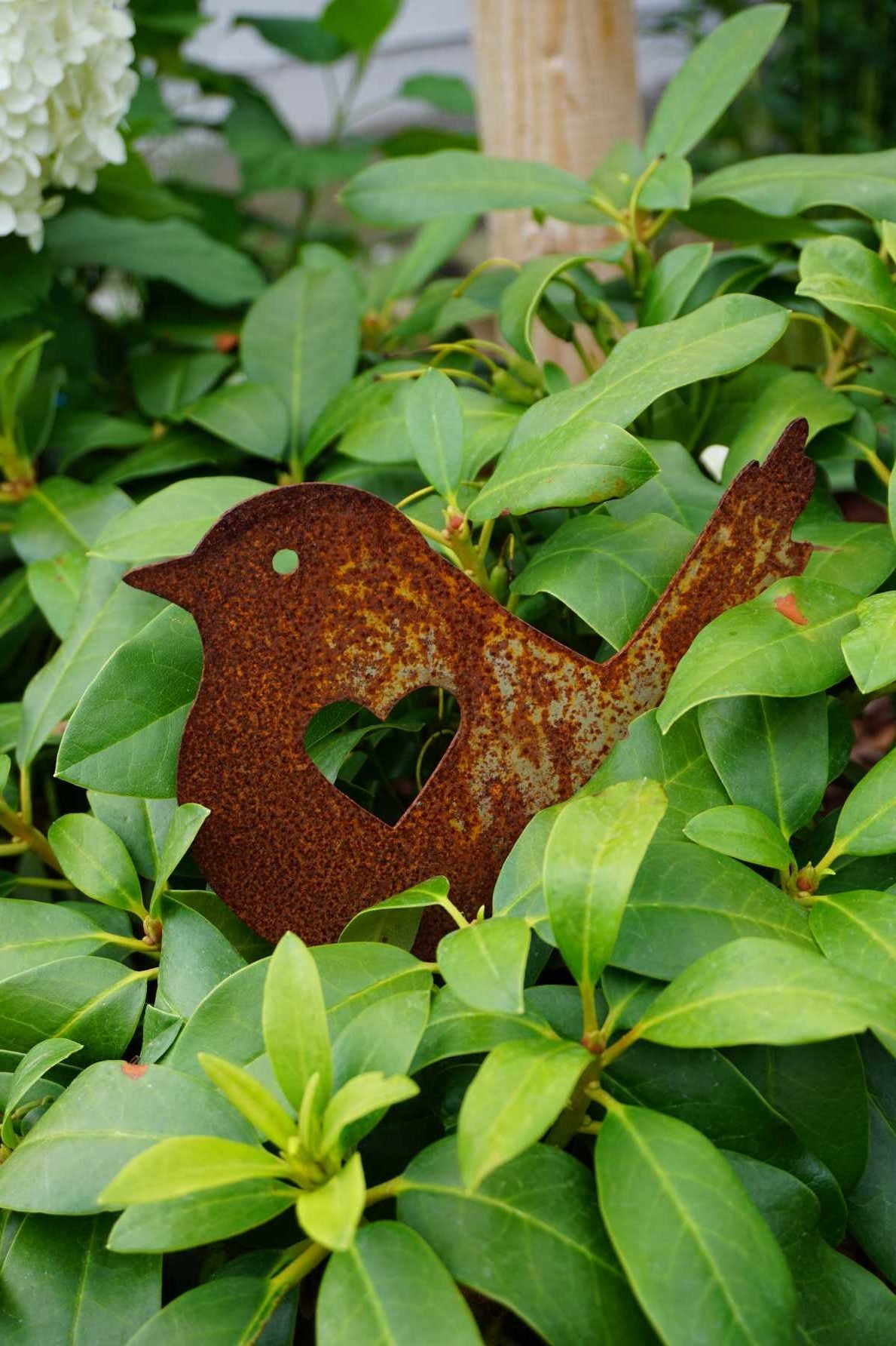 Bird with heart on a stick