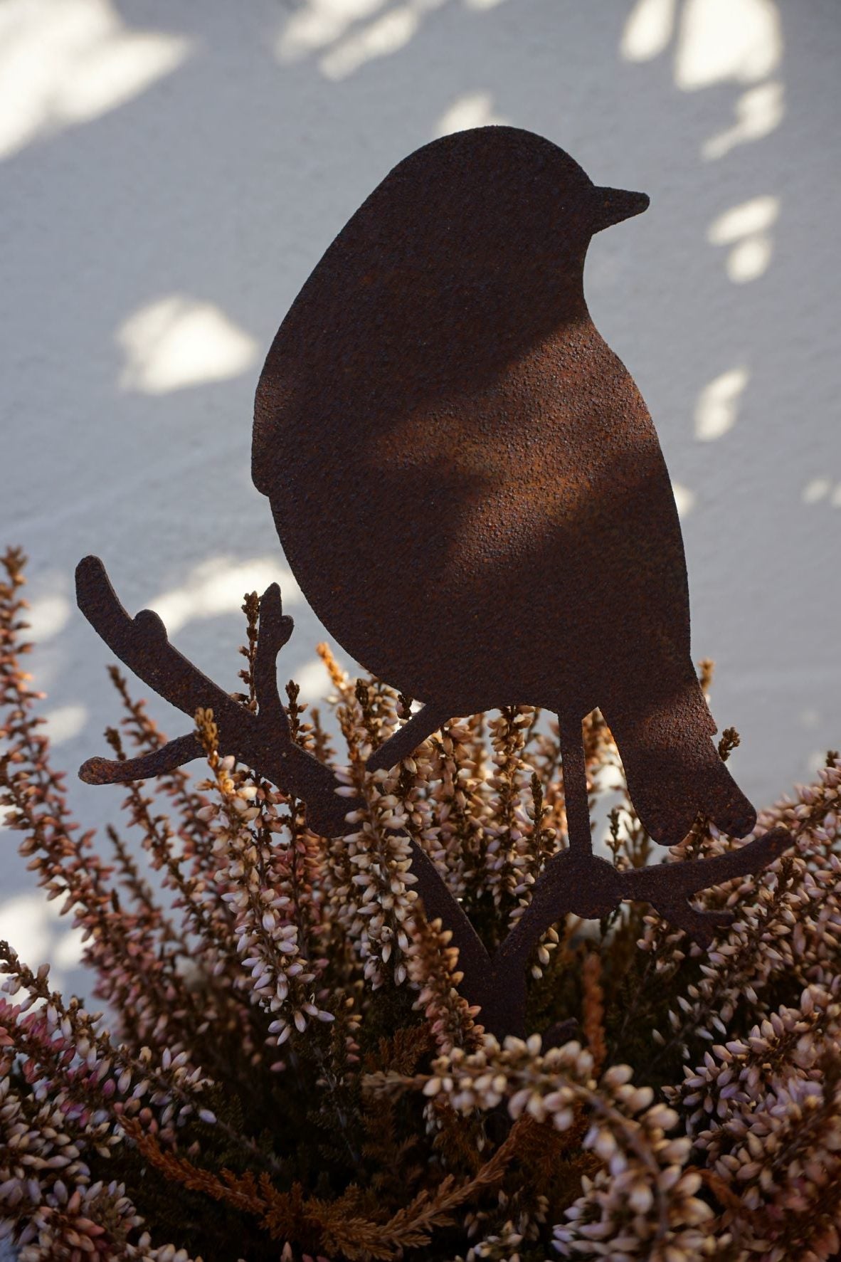 Little bird standing on a branch