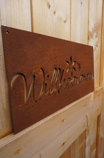Sign "Welcome" with flower